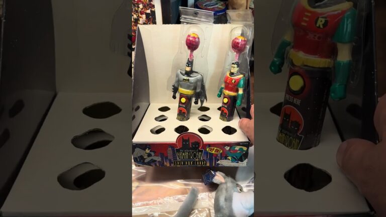 Vintage comic books and retro toys from an estate collection, including Golden Age comics, 1990s action figures and boxed playsets