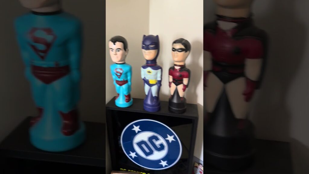 Rare pop culture collectibles in the Sell My Comix office vault, including vintage Batman and Superman memorabilia