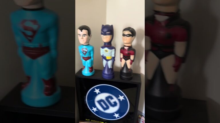 Rare pop culture collectibles in the Sell My Comix office vault, including vintage Batman and Superman memorabilia