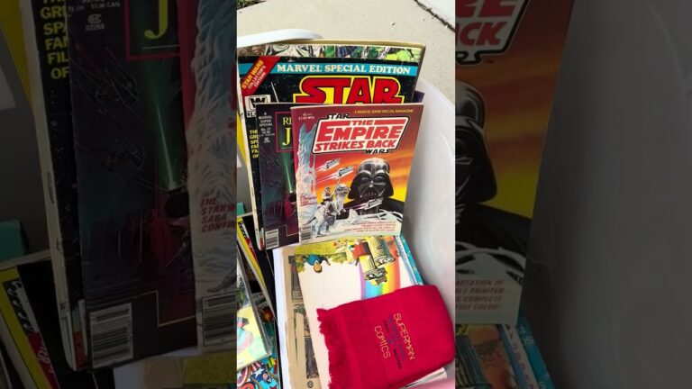 Stack of vintage comics and magazines from an inherited estate collection, including the oversized Marvel Special Edition Treasury adaptation of The Empire Strikes Back