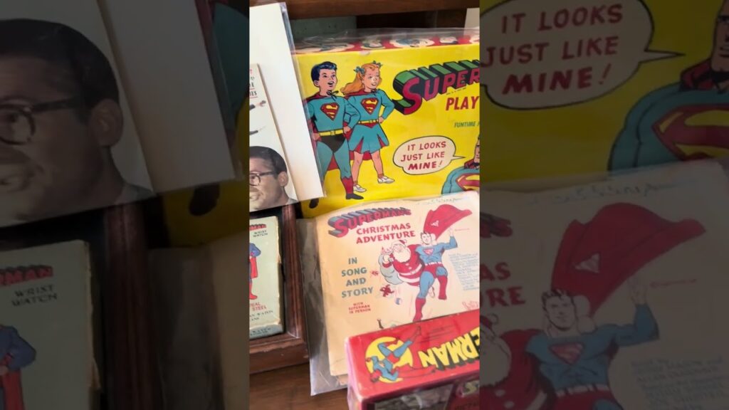 Vintage Superman collectibles and memorabilia including a Superman Christmas Adventure record and a Superman wrist watch box